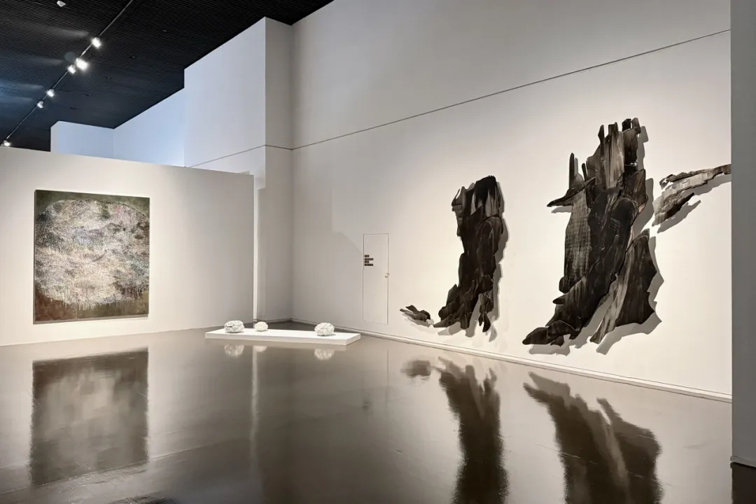 Visitors viewing abstract works